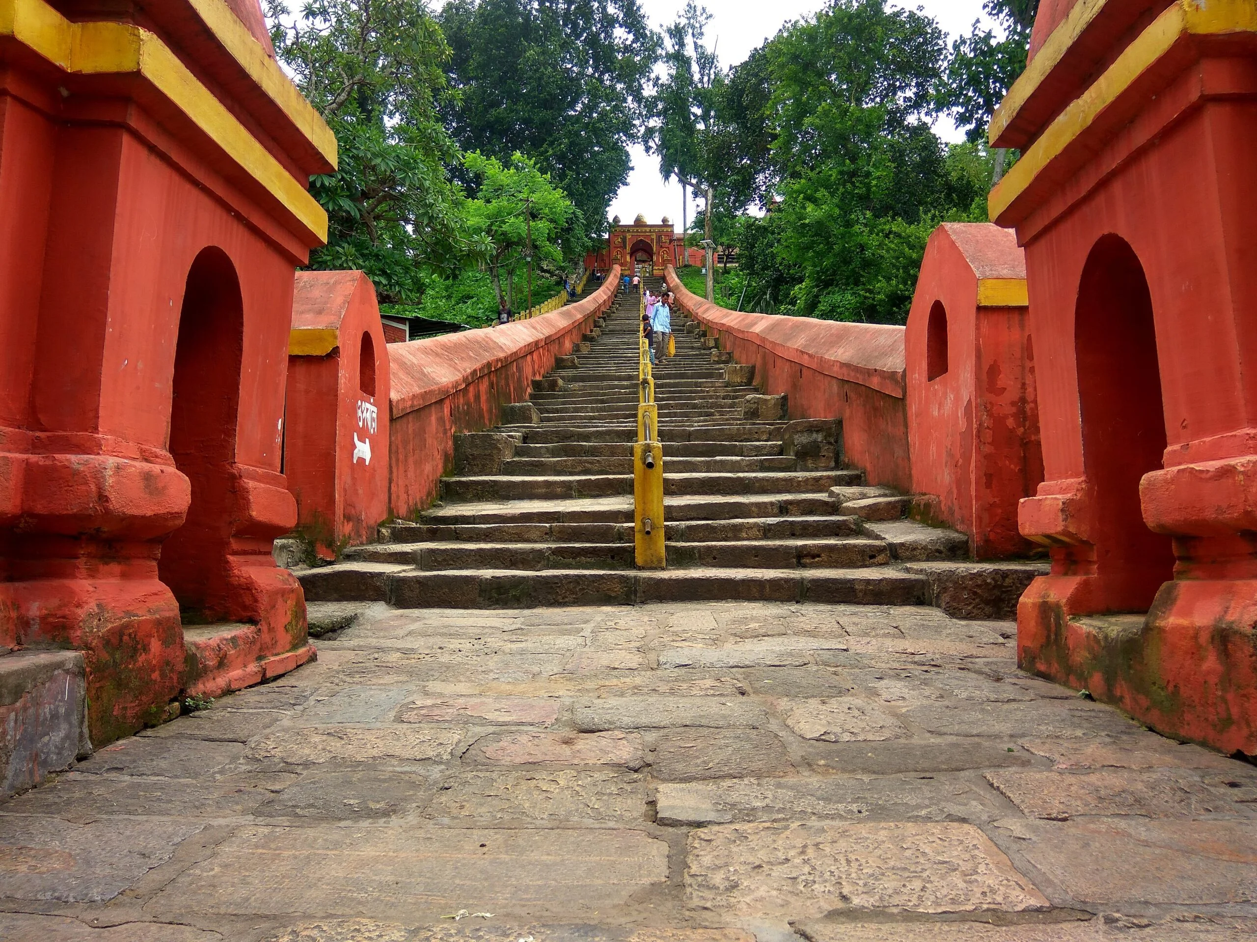 What are the most famous temples in Assam—ancient or modern?